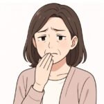 口が苦いと訴える女性